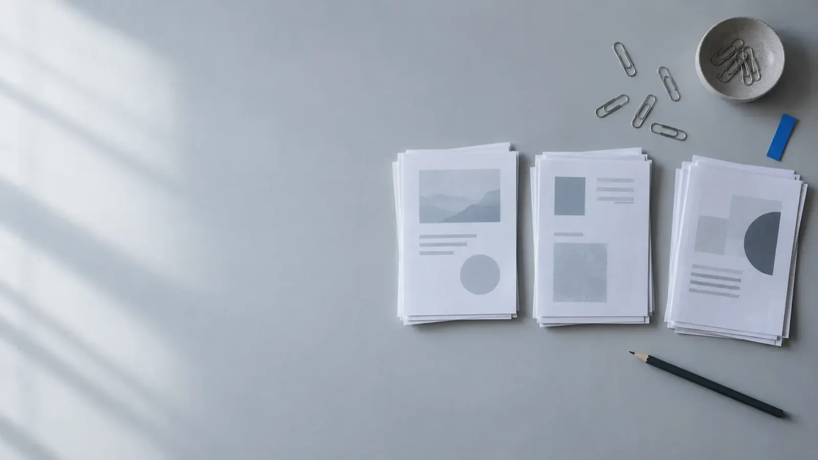 Printed message drafts sorted into three ordered stacks